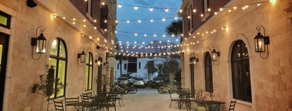 festoon lights at restaurant above dinner table