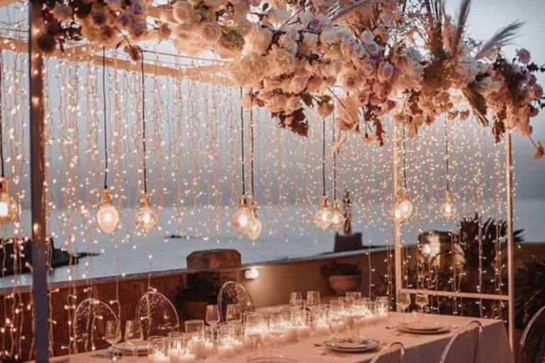 Hanging fairy lights at wedding reception