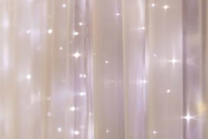 Fairy lights adorned in a white curtain